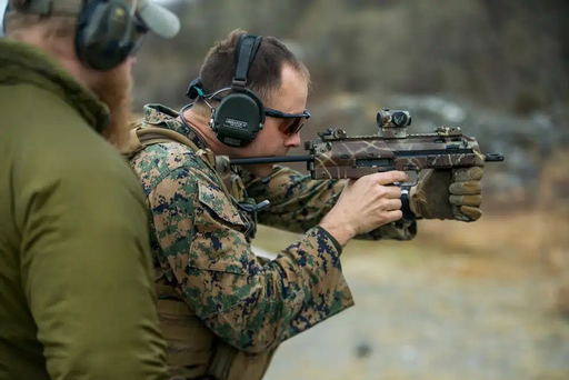https://www.sandboxx.us/news/references/weapon-systems/this-is-what-made-the-mp7-seal-team-6s-favorite-pdw/, Public domain, via Wikimedia Commons